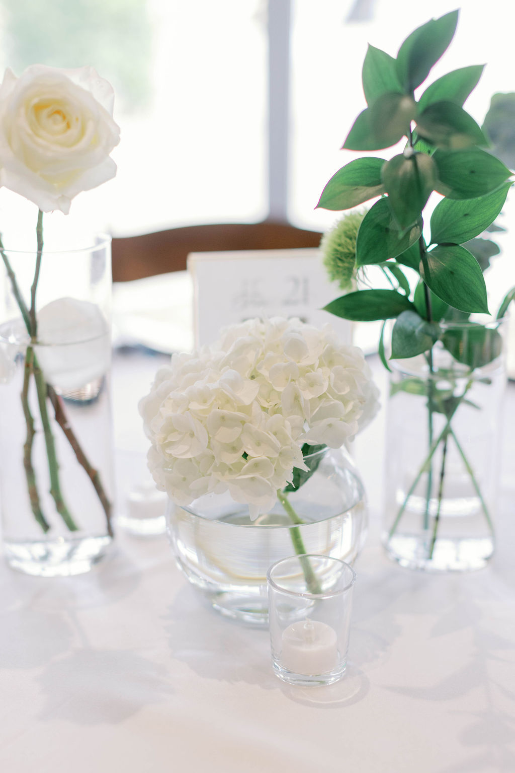 Wedding reception flowers photo by Sarah Block Photography