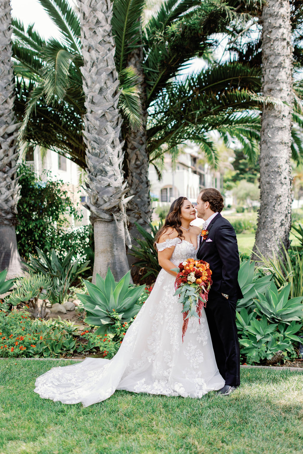 Bride and Groom Kissing at Mission Santa Barbara wedding | Photo by Sarah Block Photography