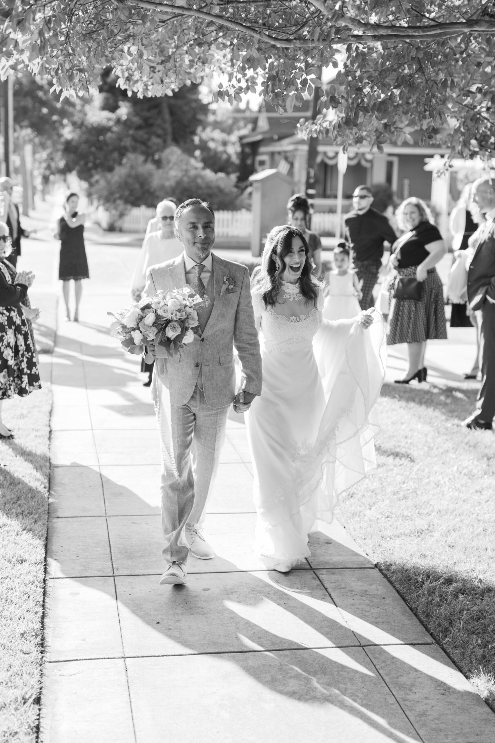 Bride and Groom walking together hand in hand at Chapel of Orange | Photo by Sarah Block Photography