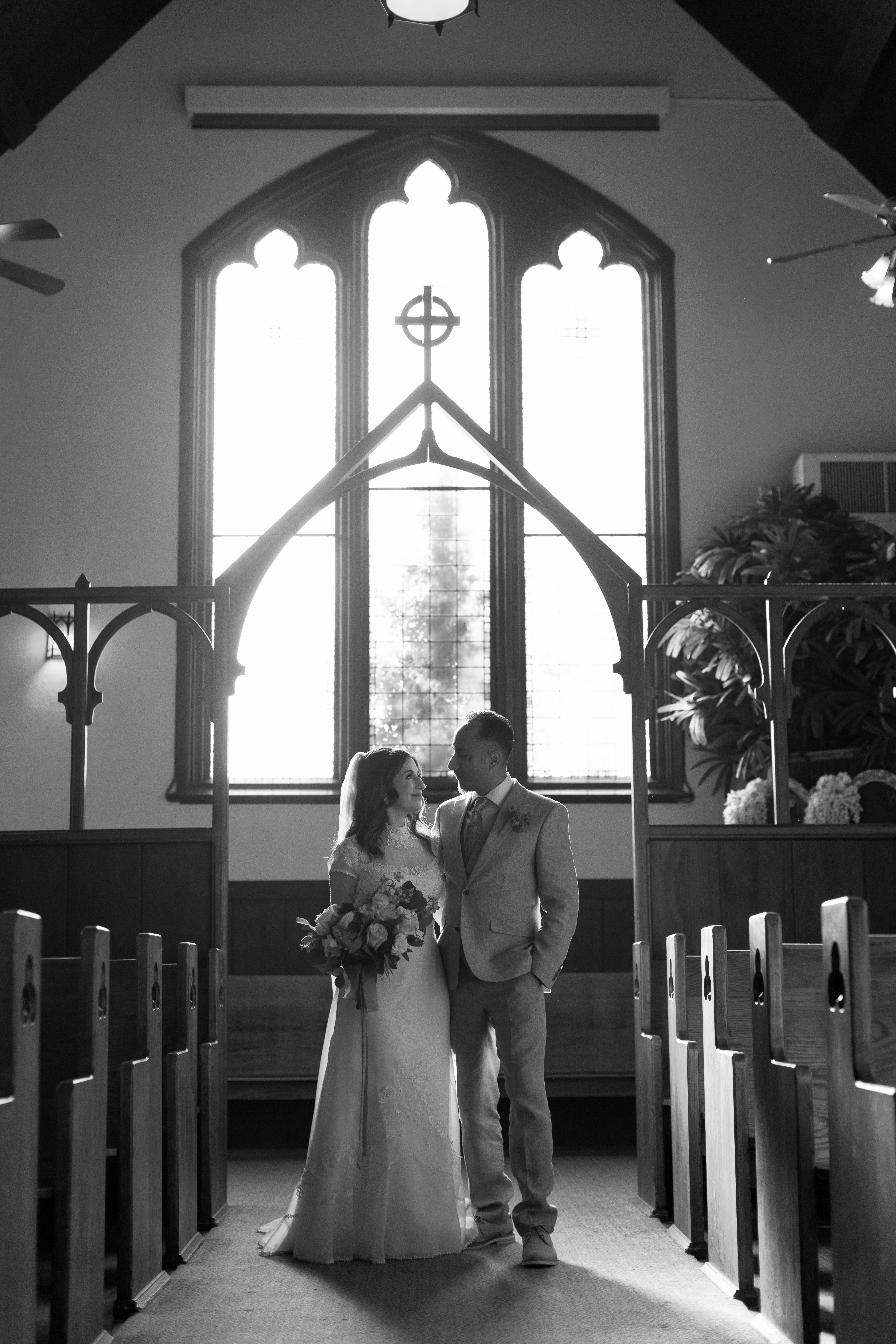 Black and white photo of Bride and Groom inside the chapel at Chapel of Orange | Photo by Sarah Block Photography