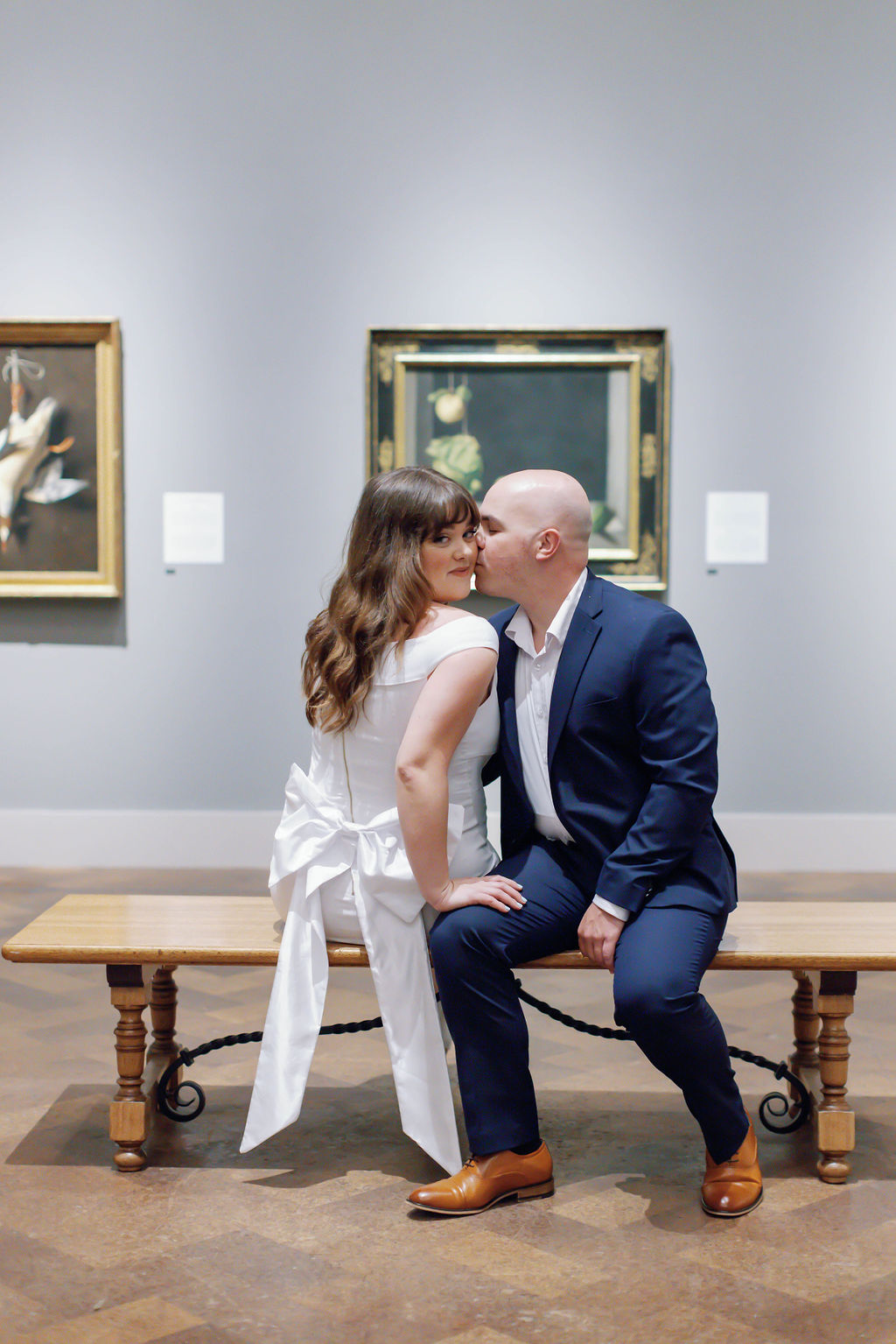 Jimmy and Hannah sit on a bench in the San Diego Museum of Art. | Photo by Sarah Block Photography