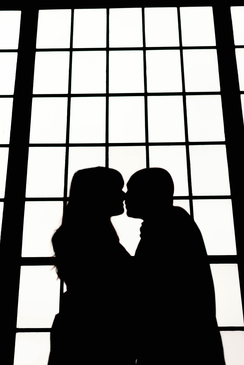 Black and white silhouette of Hannah and Jimmy standing together about to kiss. | Photo by California Photographer Sarah Block Photography
