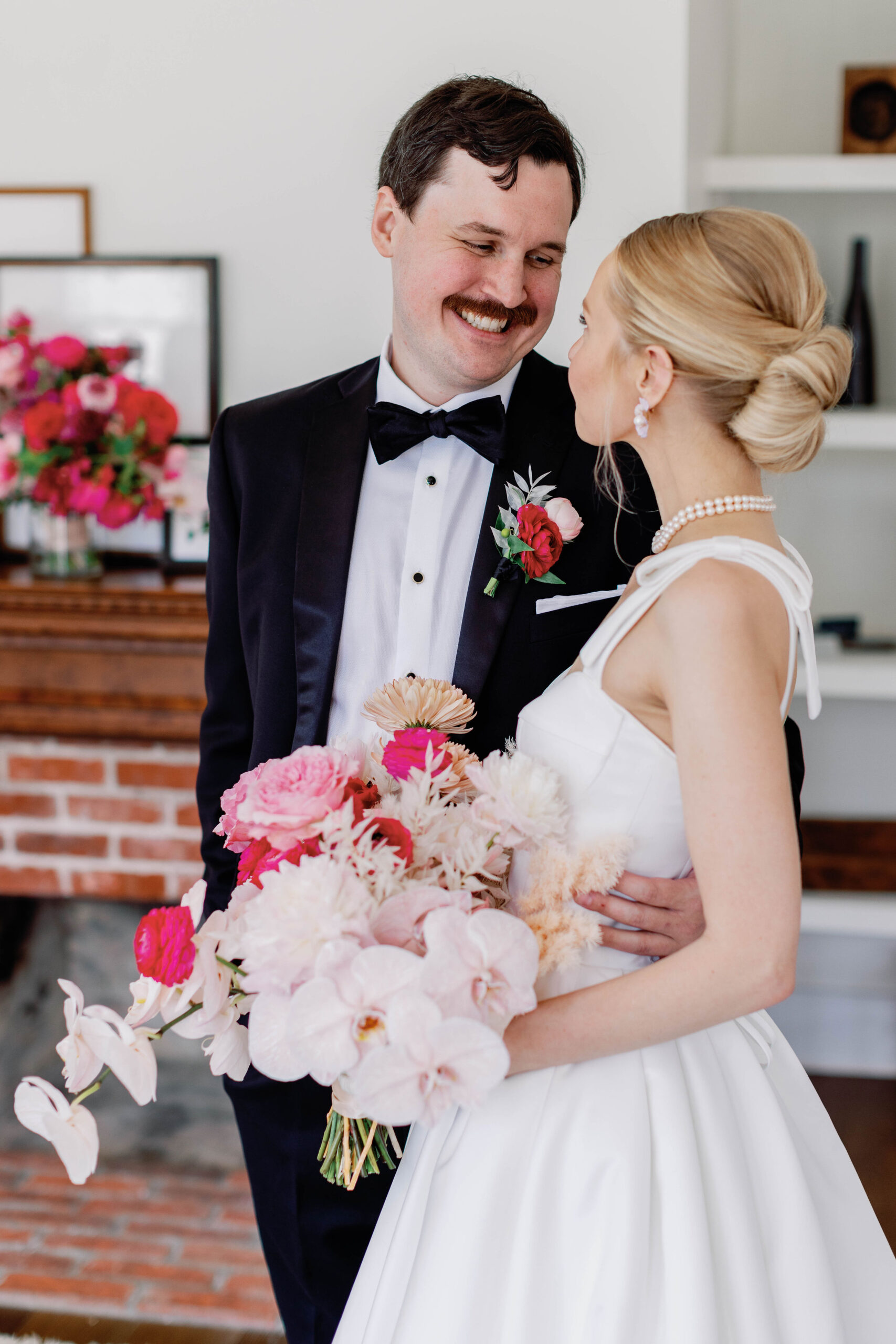 Bride and Groom together standing with wedding bouquet after first look. | Photo by Sarah of Sarah Block Photography